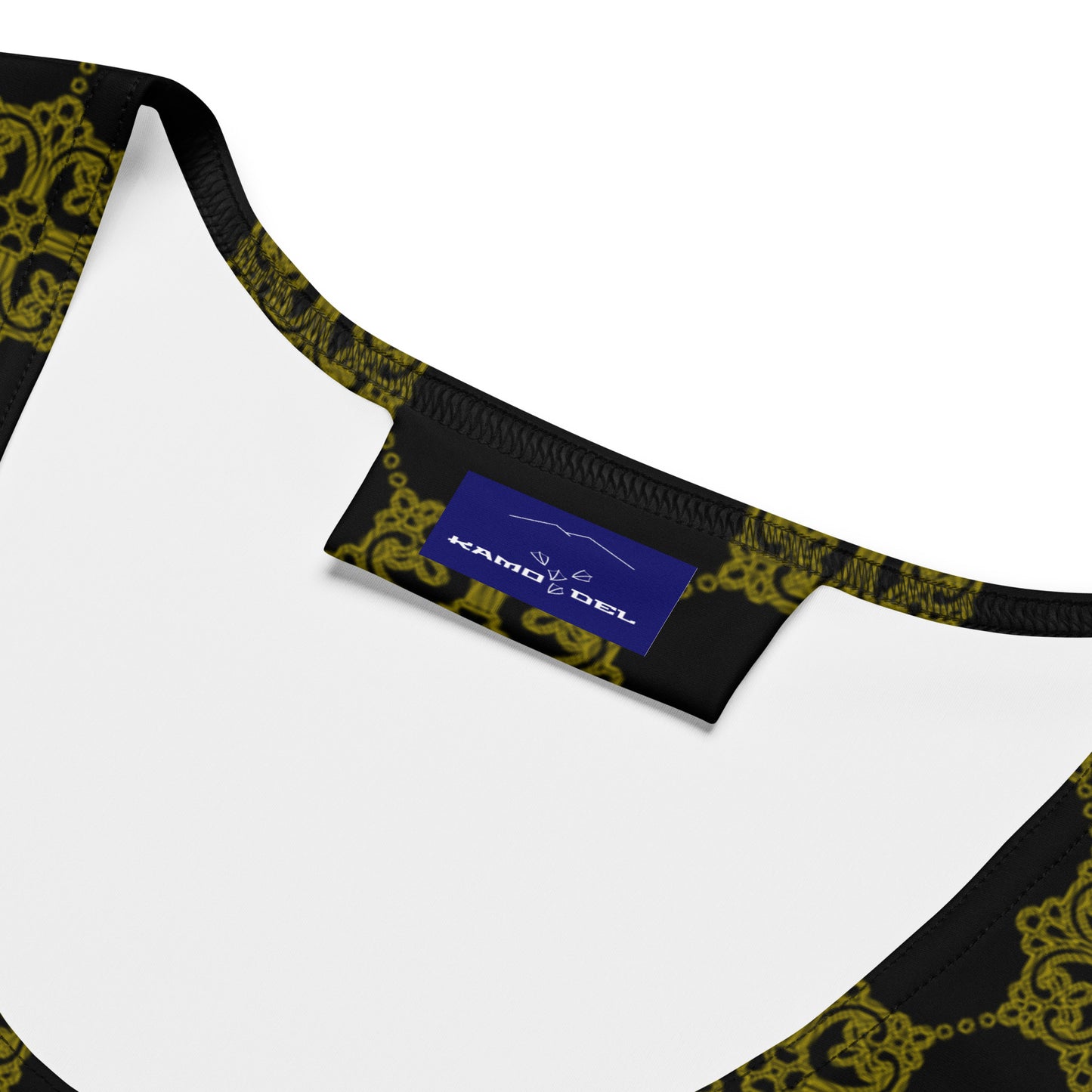 黒地に金色の割付文様のレディースワンピースの接写画像